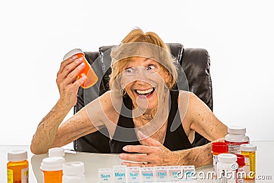 Senior Woman Ecstatic About Pills To Refill Her Weekly Pill Box Stock Photo