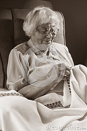 Senior woman embroidering Stock Photo