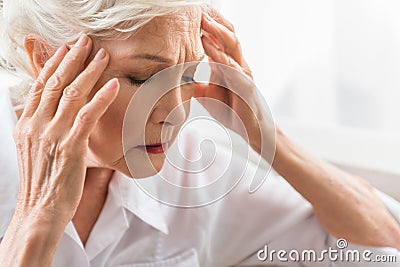 Senior woman is feeling indisposition Stock Photo