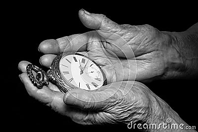 Senior woman hands holding ancient clock. Aging problems, senior Stock Photo