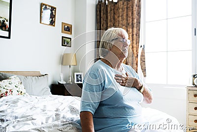 Senior woman having a heart problem Stock Photo