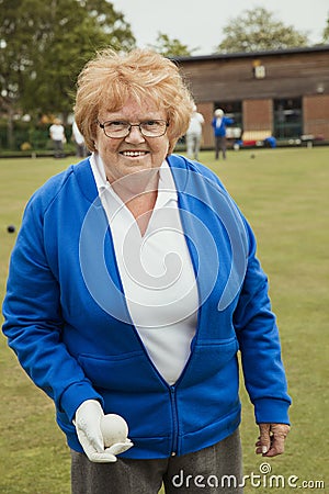 Senior Woman Holding a Bocce Ball Stock Photo