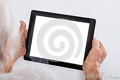 Senior Woman Holding Digital Tablet Stock Photo