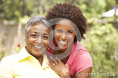 Senior Woman Hugging Adult Daughter Stock Photo