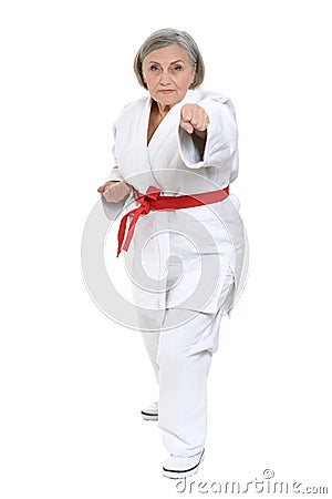 Senior woman in karate pose Stock Photo