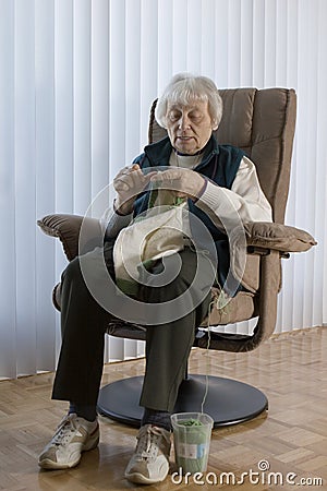 Senior Woman knitting Stock Photo