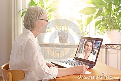 Senior woman laptop online therapy Stock Photo