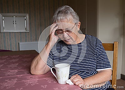 Senior woman looking depressed or worried Stock Photo