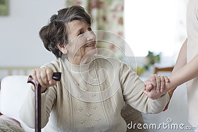 Senior woman looking at her caregiver Stock Photo