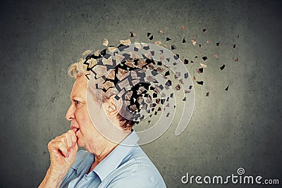 Senior woman losing parts of head feeling confused as symbol of decreased mind function. Stock Photo