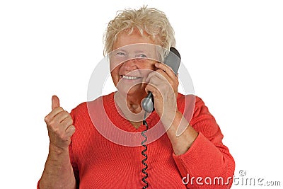Senior woman makes OK gesture on telephone Stock Photo