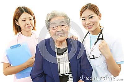 Senior woman with medical staff Stock Photo