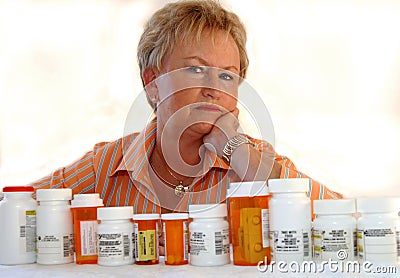 Senior woman with medicine bottles Stock Photo