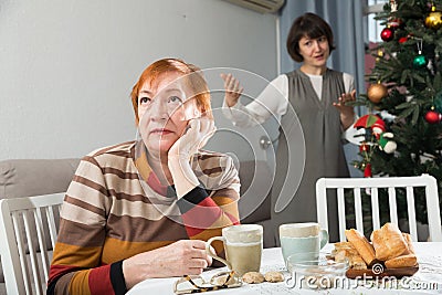 Senior woman offended after quarrel with daughter Stock Photo