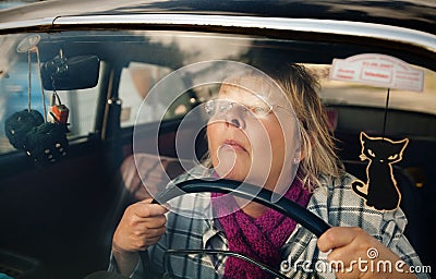 Senior woman in oldtimer car Stock Photo