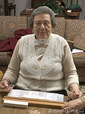 senior woman playing mah-jong Stock Photo