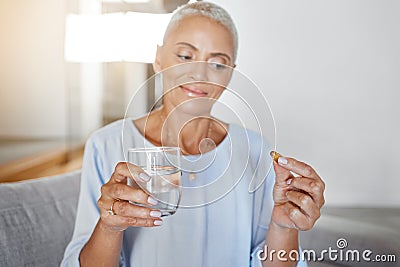 Senior woman, pregnancy pills and water in home on sofa for ivf healthcare treatment, mother wellness and prenatal care Stock Photo