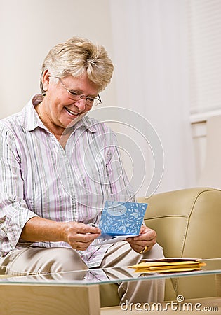 Senior woman reading note card Stock Photo