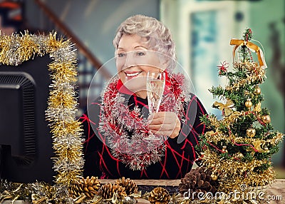 Senior woman receives Christmas greetings online Stock Photo