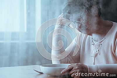 Senior woman rejecting food Stock Photo