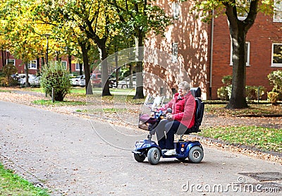 Senior woman with scooter 2 Stock Photo