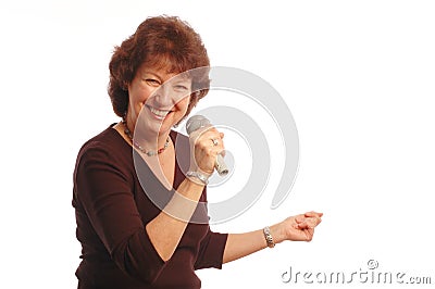 senior woman singing Microphone in hand Stock Photo