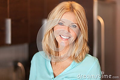 Portrait of a mature woman smiling at the camera. She is confident and proud Stock Photo