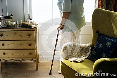 Senior woman standing alone in the room Stock Photo