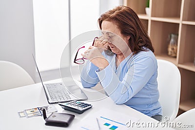 Senior woman stressed using laptop at home Editorial Stock Photo