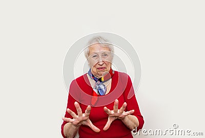 Senior woman studio portrait with disgust concept Stock Photo