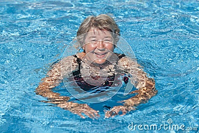Senior Woman Swimming Stock Photo