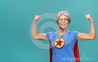 Senior woman on teal background Stock Photo