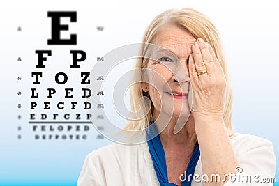 Senior woman testing vision with eye chart Stock Photo