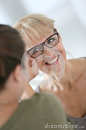 Senior woman trying on new eyeglasses Stock Photo