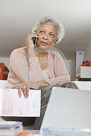Senior Woman Using Cell Phone Stock Photo