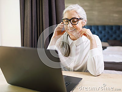 Senior Woman Using Laptop Stock Photo