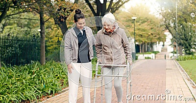 Senior woman, walker and nurse outdoor in a park with healthcare for elderly exercise. Walking, healthcare professional Stock Photo