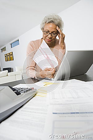 Senior Woman Worrying About Home Finances Stock Photo