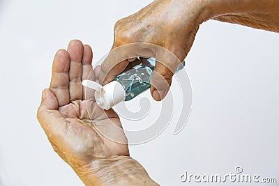 Senior woman& x27;s hands is pressing a bottle of sanitizer gel to wash her hands, Prevention from, 7 step wash hand Stock Photo