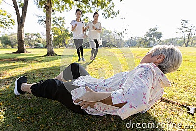 Senior woman is holding her hip,severe pain in her muscle,broken bone,injury to the waist,old elderly lying on the ground,she fell Stock Photo