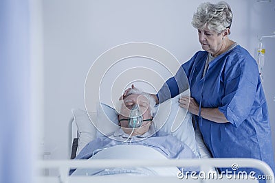 Woman watching over her husband Stock Photo