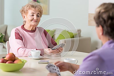 Senior women playing cards Stock Photo