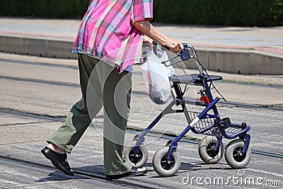 Senior women on the street with a walker Stock Photo