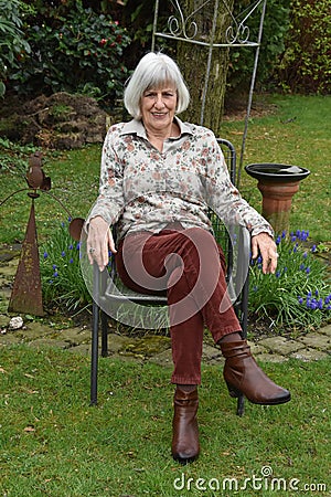 Senior woman in her garden Stock Photo