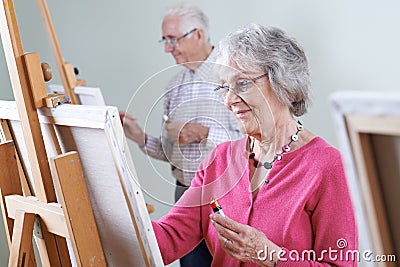 Seniors Attending Painting Class Together Stock Photo