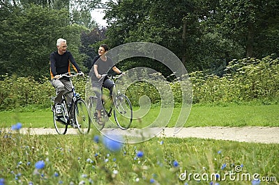 Seniors Biking Stock Photo
