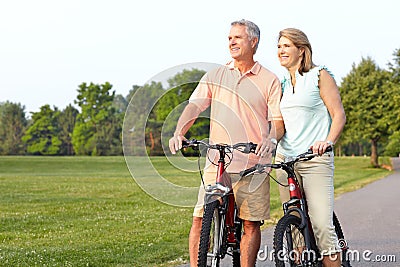 Seniors couple biking Stock Photo