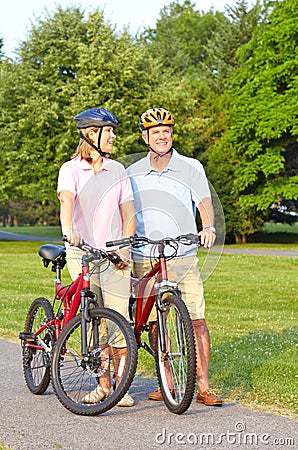 Seniors couple biking Stock Photo