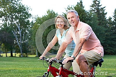 Seniors couple biking Stock Photo