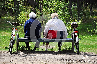 Seniors couple cyclists resting Stock Photo